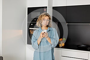 pensive young woman with wavy hair