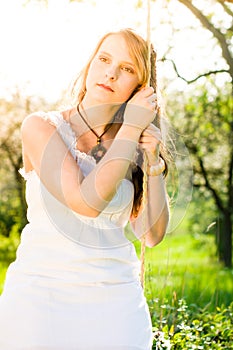 Pensively on the swing