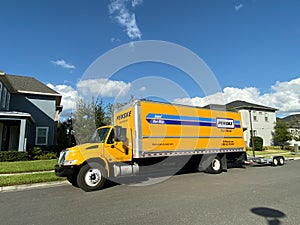 A Penske Rental truck used to move a family to a new home.  Penske Truck Rental is a privately held company owned by Penske