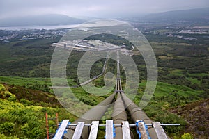 Penstocks carrying water to Fort William aluminium smelter plant, Loch Linnhe in background, cloudy foggy day
