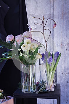 Peonies. Bouquet of peonies in a glass vase. Hyacinth.