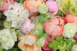 Peonies in a wedding arrangement photo