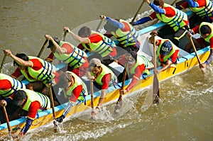 People in activity, rowing dragon boat in racing
