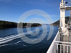 People admiring the beautiful views of the gulf islands on a BC ferries trip through active pass, in the gulf islands, British Col