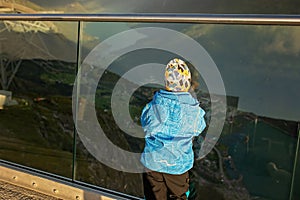 People, adult with kids and pet dog, hiking mount Hoven, enjoying the splendid view over Nordfjord from Loen skylift