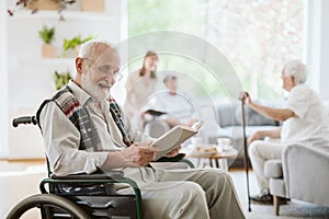 People during afternoon in the nursing home living room