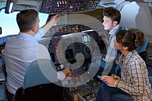people in aircraft simulator
