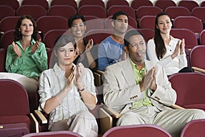 People Applauding At A Performance