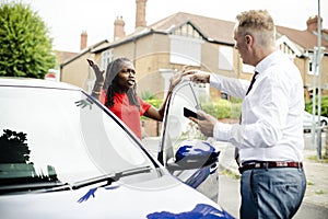 People arguing after a car accident