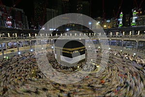 Muslim pilgrims from all around the world doing tawaf photo