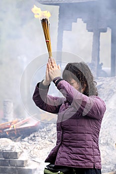 People asking Buddha to bless.