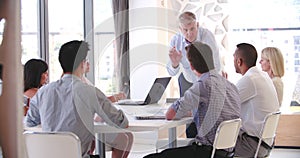 People Attending Business Meeting In Modern Open Plan Office