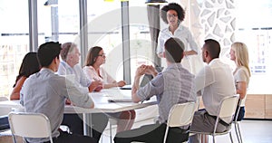 People Attending Business Meeting In Modern Open Plan Office