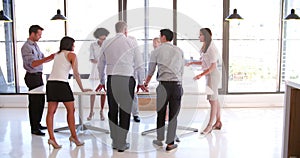 People Attending Business Meeting In Modern Open Plan Office