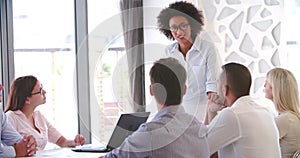 People Attending Business Meeting In Modern Open Plan Office