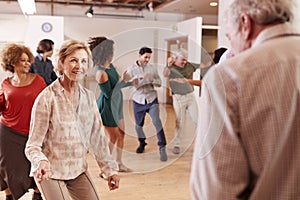 People Attending Dance Class In Community Center