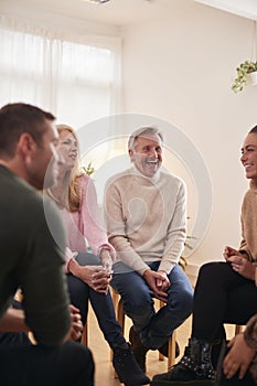 People Attending Support Group Meeting For Mental Health Or Dependency Issues In Community Space