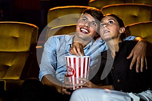 People audience watching movie in cinema theater.