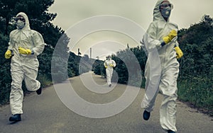 People with bacteriological protection suits running