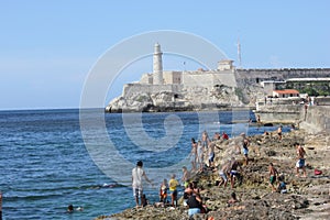 People bathing and the Castle of the Royal Force, Havana