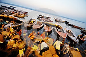 People bathing and performing religious rituals