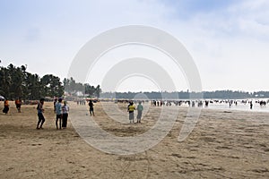 People on the beach in Chaung Thar, Myanmar