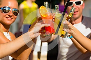 People at beach drinking having a party