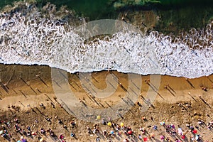 People on the beach from drone