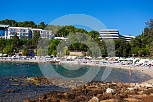 People on the beach in Rovinj town, Croatia