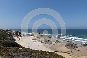 People at the beach during the summer in Porto Covo, in Alentejo photo