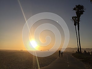 People on the beach at sunset in southern California