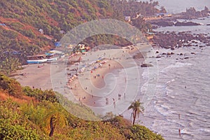 People on the beach. View from the top of the beach Vagator, Ind