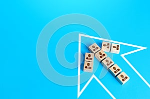 People blocks form an arrow. The concept of joint efforts and moving forward. Unity, cooperation, going towards the intended goal photo