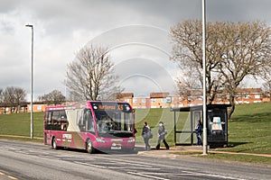 People boarding a public transport bus