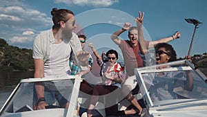 People on boat with colored smoke