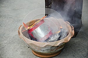 People burn joss paper gold and silver paper for worship