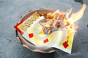 People burn joss paper gold and silver paper for worship