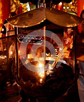People burning incense in the temple