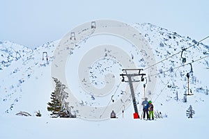 People on button ski lift on Feuerkogel mountain plateau, Salzkammergut, Austria