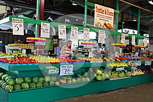 People buy groceries at Jean-Talon Market is a farmer`s market