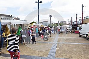 People buying stuff from the ambulant flea market from Bruges