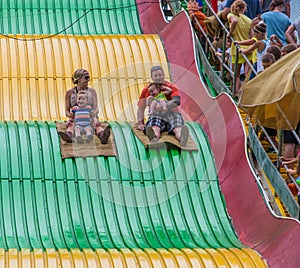 People on carnival slide at state fair