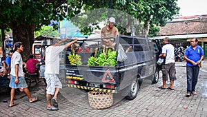 People carrying fresh fruits to the market in Bali, Indonesia