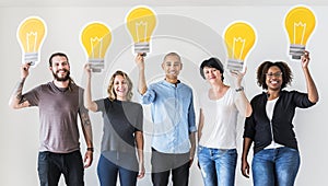 People carrying light bulb icons