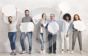 People carryng speech bubble icons at studio