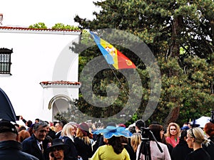 People celebrate the monarchy day in the courtyard of the Elisabeth Palace