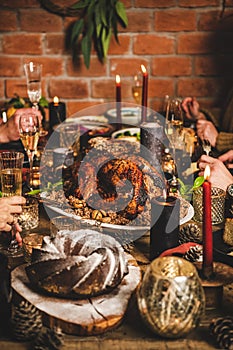 People celebrating Christmas or New Year with turkey and snacks