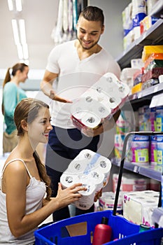 People choose toilet paper in shop