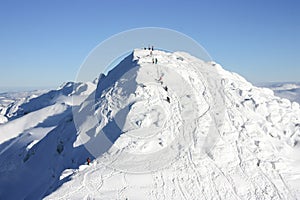 People climbing Chopok Peak, 2024 m photo