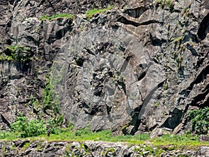 People climbing a quarry disabled rock wall